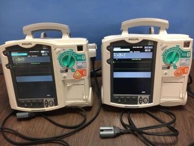 2 x Philips Heartstart MRx Defibrillators Including Pacer, ECG and Printer Options with 2 x Philips M3539A Batteries, 2 x Philips M3538 Module and 2 x