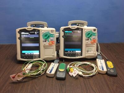 2 x Philips Heartstart MRx Defibrillators Including Pacer, ECG and Printer Options with 2 x Paddle Leads, 2 x ECG Leads,2 x 50 Ohm Test Loads, 2 x Lae