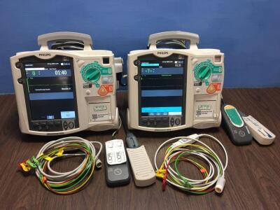 2 x Philips Heartstart MRx Defibrillators Including Pacer, ECG and Printer Options with 2 x Paddle Leads, 2 x ECG Leads,2 x 50 Ohm Test Loads, 2 x Lae