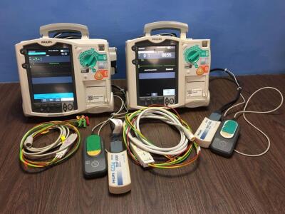 2 x Philips Heartstart MRx Defibrillators Including Pacer, ECG and Printer Options with 2 x Paddle Leads, 2 x ECG Leads,2 x 50 Ohm Test Loads, 2 x Lae