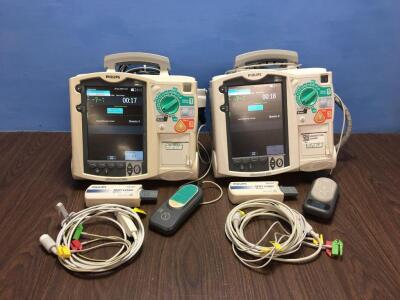 2 x Philips Heartstart MRx Defibrillators Including Pacer, ECG and Printer Options with 2 x Paddle Leads, 2 x ECG Leads,2 x 50 Ohm Test Loads, 2 x Lae