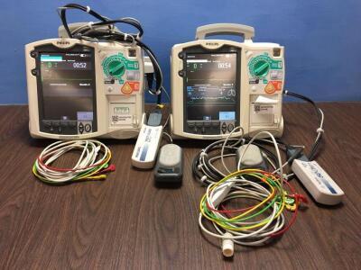 2 x Philips Heartstart MRx Defibrillators Including Pacer, ECG and Printer Options with 2 x Paddle Leads, 2 x ECG Leads,2 x 50 Ohm Test Loads, 2 x Lae