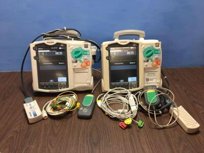 2 x Philips Heartstart MRx Defibrillators Including Pacer, ECG and Printer Options with 2 x Paddle Leads, 2 x ECG Leads,2 x 50 Ohm Test Loads, 2 x Lae