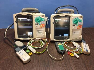 2 x Philips Heartstart MRx Defibrillators Including Pacer, ECG and Printer Options with 2 x Paddle Leads, 2 x ECG Leads,2 x 50 Ohm Test Loads, 2 x Lae