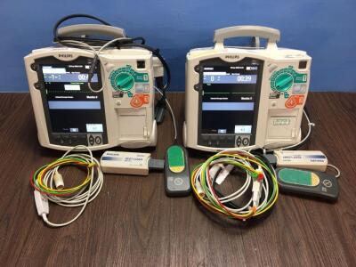 2 x Philips Heartstart MRx Defibrillators Including Pacer, ECG and Printer Options with 2 x Paddle Leads, 2 x ECG Leads,2 x 50 Ohm Test Loads, 2 x Lae