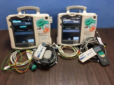 2 x Philips Heartstart MRx Defibrillators Including Pacer, ECG and Printer Options with 2 x Paddle Leads, 2 x ECG Leads,2 x 50 Ohm Test Loads, 2 x Lae