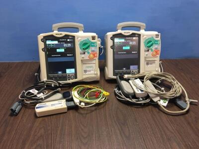 2 x Philips Heartstart MRx Defibrillators Including Pacer, ECG and Printer Options with 2 x Paddle Leads, 2 x ECG Leads,2 x 50 Ohm Test Loads, 2 x Lae