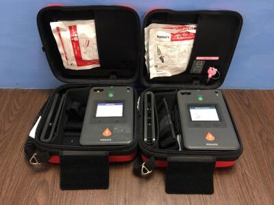 2 x Philips Heartstart FR3 Defibrillators with Batteries in Cases (Both Power Up) (G)