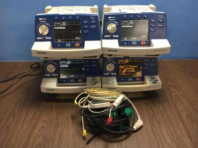 4 x Philips Heartstart XL Defibrillators with 4 x Paddle Leads and 2 x ECG Leads (All Power Up when Plugged in to Mains) *S/N 084340 / 084336 / 091376