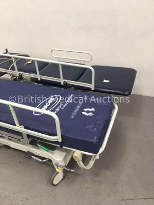 1 x Akron Electric 3-Way Patient Examination Couch and 1 x Merivaara Acute Care Line Hydraulic Patient Trolley with Mattress (Powers Up-Large Rip to C - 2