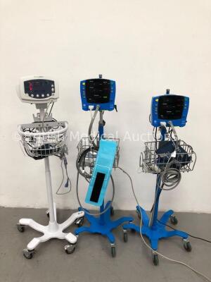 2 x GE Carescape V100 Dinamap Patient Monitors on Stands with 2 x BP Hoses, 2 x BP Cuffs and 2 x SpO2 Finger Sensors and 1 x Welch Allyn 53N00 Patient