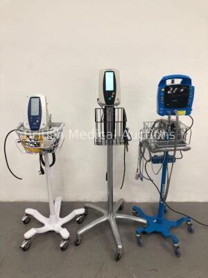2 x Welch Allyn Spot Vital Signs Monitors on Stands with 2 x BP Hoses and 1 x SpO2 Finger Sensor and 1 x GE ProCare Auscultatory 300 Patient Monitor o