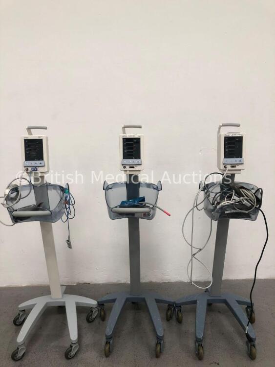 3 x Datascope Duo Patient Monitors on Stands with 2 x SpO2 Finger Sensors, 3 x BP Hoses, 3 x BP Cuffs and 1 x 3-Lead ECG Lead (All Power Up) * SN MD16