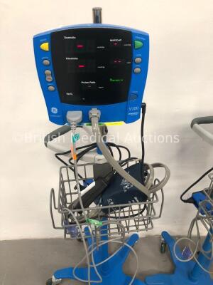 4 x GE Carescape V100 Dinamap Patient Monitors on Stands with 4 x BP Hoses,4 x BP Cuffs and 4 x SpO2 Finger Sensors (All Power Up) * SN SH614040092SA - 2