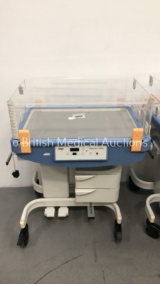 4 x Drager Babytherm 8000 Infant Incubators (All Power Up - 4 x No Lids, 1 x Missing Side Panel and 1 x Damaged Side Panel) * SN ASAC-0004 / ARYK-0011 - 4