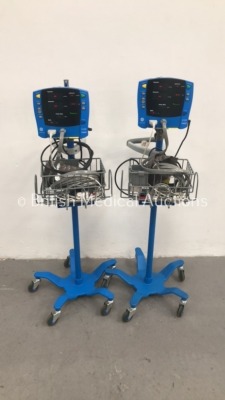 2 x GE Carescape V100 Vital Signs Monitors on Stands with SPO2 Finger Sensors, BP Hose and Cuff (Both Power Up) *S/N SDT09060295SP / SDT09060300SP*