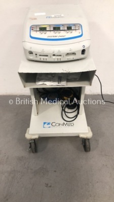 ConMed System 2450 Electrosurgical Unit Model 60-2450-230 on ConMed Trolley with 1 x Dual Footswitch and 1 x Bipolar Dome Footswitch (Powers Up) * SN