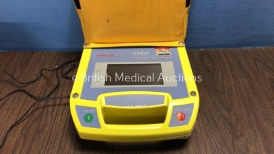 Mixed Lot Including 1 x Schiller Fred First Responder External Defibrillator (No Power) 1 x First Save Automated External Defibrillator (No Power) 1 x