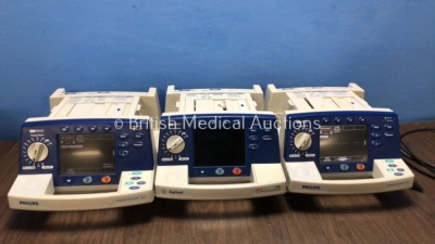 2 x Philips Heartstart XL Smart Biphasic Defibrillators Including Pacer, ECG and Printer Options (Both Power Up) 1 x Agilent XL Heartstream Defibrilla