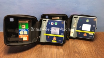 2 x Philips Heartstart FR2+ Defibrillators in Carry Cases (Both Power Up and Pass Self Test with Stock Batteries - Not Included)