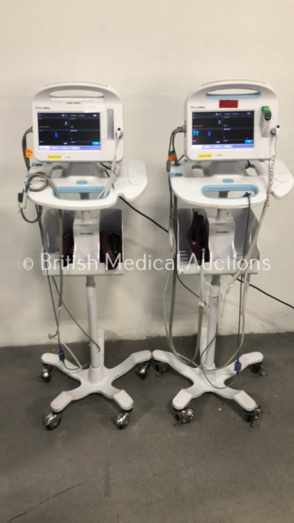 2 x Welch Allyn 6000 Series Patient Monitors on Stands with SPO2, BP and Temp Options and Leads (Both Power Up)