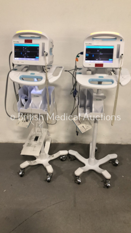 2 x Welch Allyn 6000 Series Patient Monitors on Stands with SPO2, BP and Temp Options and Leads (Both Power Up)