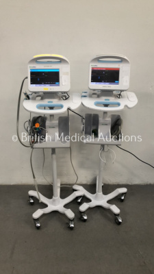 2 x Welch Allyn 6000 Series Patient Monitors on Stands with SPO2 and BP Options and Leads (Both Power Up)