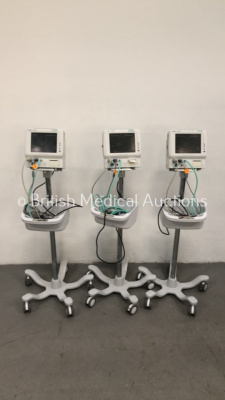 3 x Fukuda Denshi Dynascope Patient Monitors on Stands with Cables (All Power Up) *S/N 50001956 / 50001983 / 50001978*