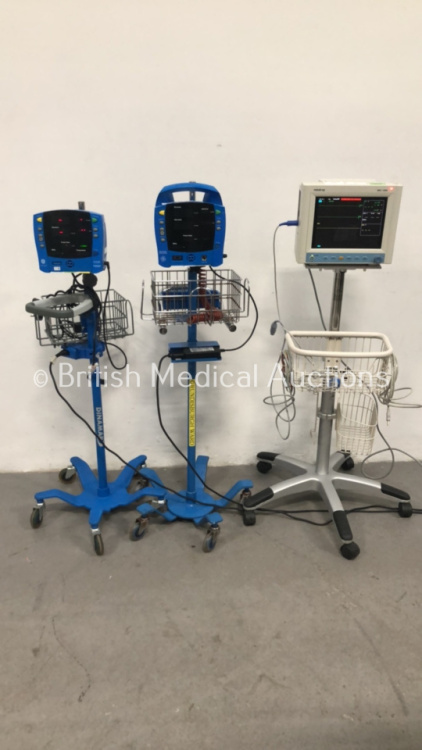 1 x GE ProCare Auscultatory Vital Signs Monitor on Stand, 1 x GE Carescape Vital Signs Monitor on Stand and 1 x Mindray MEC-1000 Patient Monitor on St