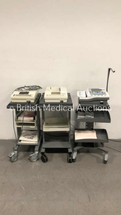 1 x Burdick Eclipse 850 ECG Machine on Stand (Powers Up - Spares and Repairs) 1 x Burdick Atria 6100 ECG Machine on Stand (No Power) and 1 x Spacelabs