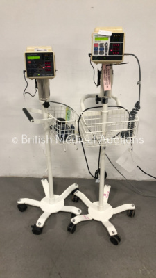 2 x CSI Criticare 506DXN Vital Signs Monitors on Stands (Both Power Up - 1 x Missing Wheel)