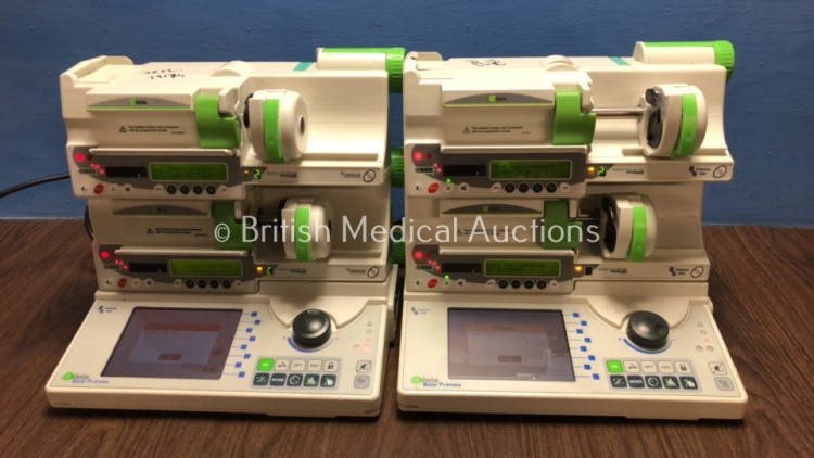 2 x Fresenius Kabi Orchestra Base Primea Docking Stations with 4 x Fresenius Model DPS Visto Syringe Pumps (All Power Up with Some Casing Damage - See