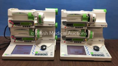 2 x Fresenius Kabi Orchestra Base Primea Docking Stations with 4 x Fresenius Model DPS Visto Syringe Pumps (All Power Up with Some Casing Damage - See