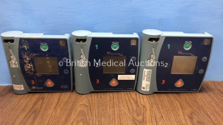 Job Lot Including 2 x Agilent FR2 Defibrillators (Both Power Up, 1 with Damaged Screen - See Photo) and 1 x Laerdal Heartstart Defibrillator (Powers U