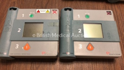 2 x Forerunner and 2 x Hewlett Packard Heartstream Semi-Automatic Defibrillators with 1 x Battery (Untested Due to Flat Battery) - 3