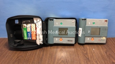 1 x Laerdal Heartstart FR and 1 x Hewlett Packard Heartstream Semi Automatic Defibrillators with 1 x Battery and 1 x Carry Case (Both Power Up and Pas