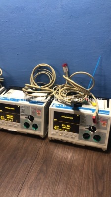 4 x Zoll M Series Defibrillators with Pacer and ECG Options with 4 x Paddle Leads, 4 x 3 Lead ECG Leads and 4 x Batteries (All Power Up When Plugged i - 3