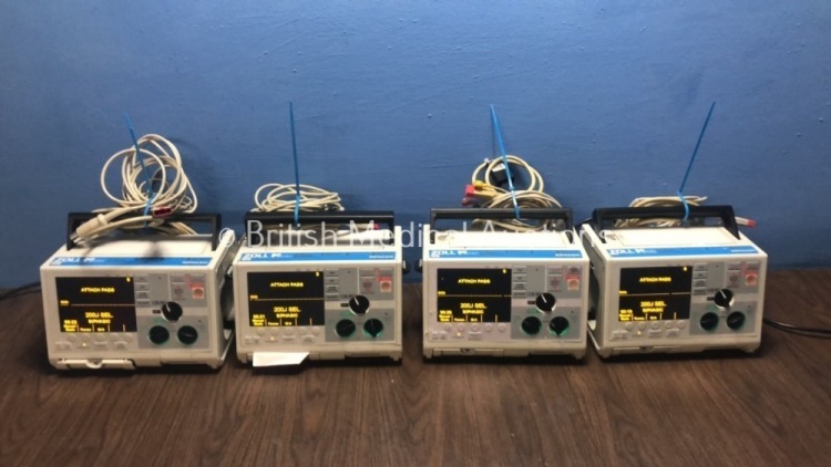 4 x Zoll M Series Defibrillators with Pacer and ECG Options with 4 x Paddle Leads, 4 x 3 Lead ECG Leads and 4 x Batteries (All Power Up When Plugged