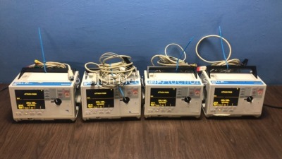 4 x Zoll M Series Defibrillators with EGG Option with 4 x Paddle Leads, 4 x 3 Lead ECG Leads and 4 x Batteries (All Power Up When Plugged in to Mains)