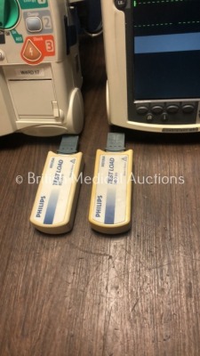 2 x Philips Heartstart MRx Defibrillators Including Pacer, ECG and Printer Option with 2 x Philips M3539A Batteries, 2 x Philips M3538 Module, 2 x Pad - 4