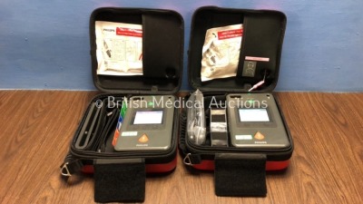 2 x Philips Heartstart FR3 Defibrillators with Batteries - Install Dates 2023-04 / 2022-07 in Cases, 1 with Marks -See Photo (Both Power Up) *C15C-010
