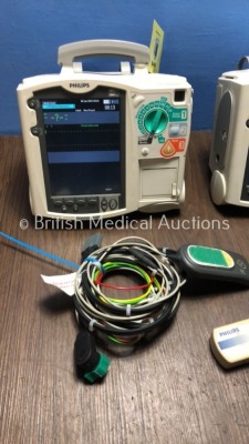 2 x Philips Heartstart MRx Defibrillators Including Pacer, ECG and Printer Options with 2 x Philips M3539A Batteries, 2 x Philips M3538 Module, 2 x Pa