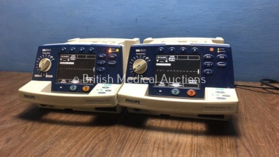 2 x Philips HeartStart XL Smart Biphasic Defibrillators with Pacer,ECG and Printer Options (Both Power Up) * SN US00451211 / US00594782 * - 2