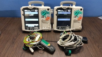 2 x Philips Heartstart MRx Defibrillators Including Pacer, ECG and Printer Options with 2 x Philips M3539A Batteries, 2 x Philips M3538 Module, 2 x Pa