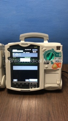 2 x Philips HeartStart MRx Defibrillators with BP1,BP2,NBP,ECG,SpO2,Temp and CO2 Options,2 x Modules and 2 x Batteries (Both Power Up-1 x Damage to Sc - 9