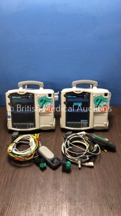 2 x Philips Heartstart MRx Defibrillators Including Pacer, ECG and Printer Options with 2 x Philips M3539A Batteries, 2 x Philips M3538 Module, 2 x Pa