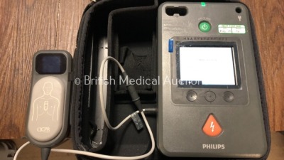 2 x Philips Heartstart FR3 Defibrillators in Cases with 1 x Battery and 1 x QCPR Meter (Both Power Up) *C16C-00106 / C13L-00518* (H) - 2