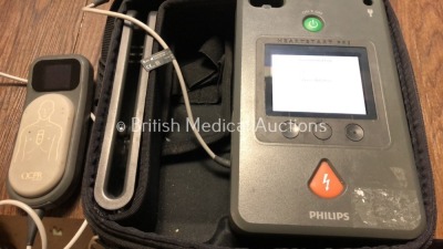 2 x Philips Heartstart FR3 Defibrillators in Cases with 1 x Battery and 1 x QCPR Meter (Both Power Up) *C15A-01208 / C14F-01177* (H) - 2