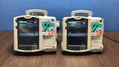 2 x Philips HeartStart MRx Defibrillators with ECG and Printer Options,2 x Modules and 1 x Battery (Both Power Up) * SN US00315818 / US00326434 * *H*