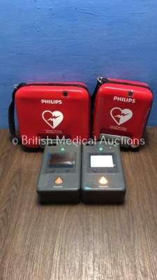 2 x Philips HeartStart FR3 Defibrillators in Cases with 1 x Battery * Install Before 2023 * (Both Power Up with Battery,1 x Battery Included) * SN C14